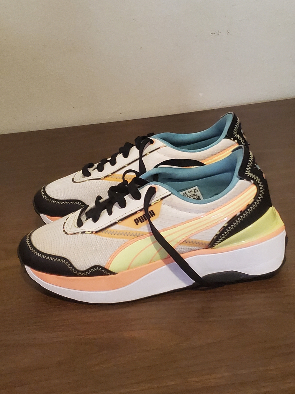Pumas Woman Cream, Peach & Lemon cruise rider wave Sneaker with Black Trim